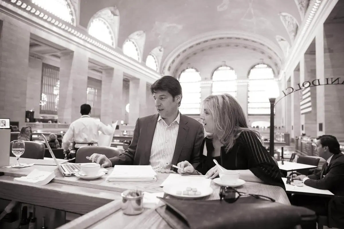Leslie Zane in conversation at a table in Grand Central